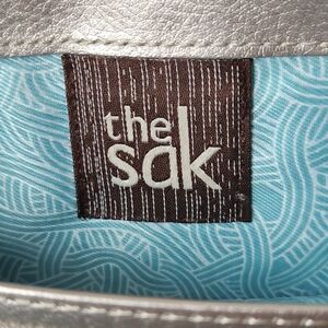 The Sak Silver Clutch with Light Blue Liner